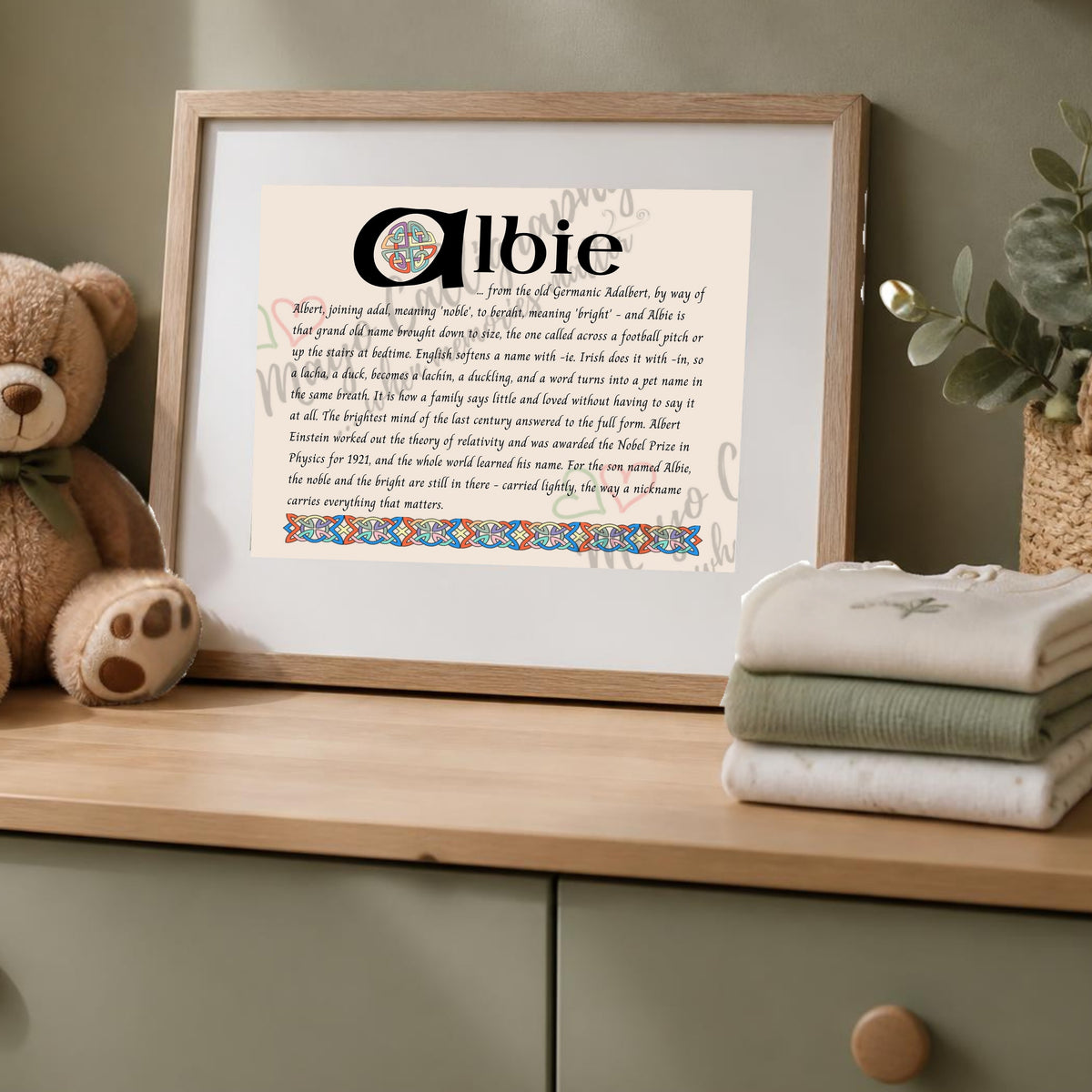 Albie Celtic name print in a wooden frame on a dresser with a teddy bear