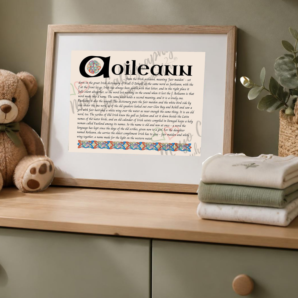 Aoileann Celtic name print in a wooden frame on a dresser with a teddy bear