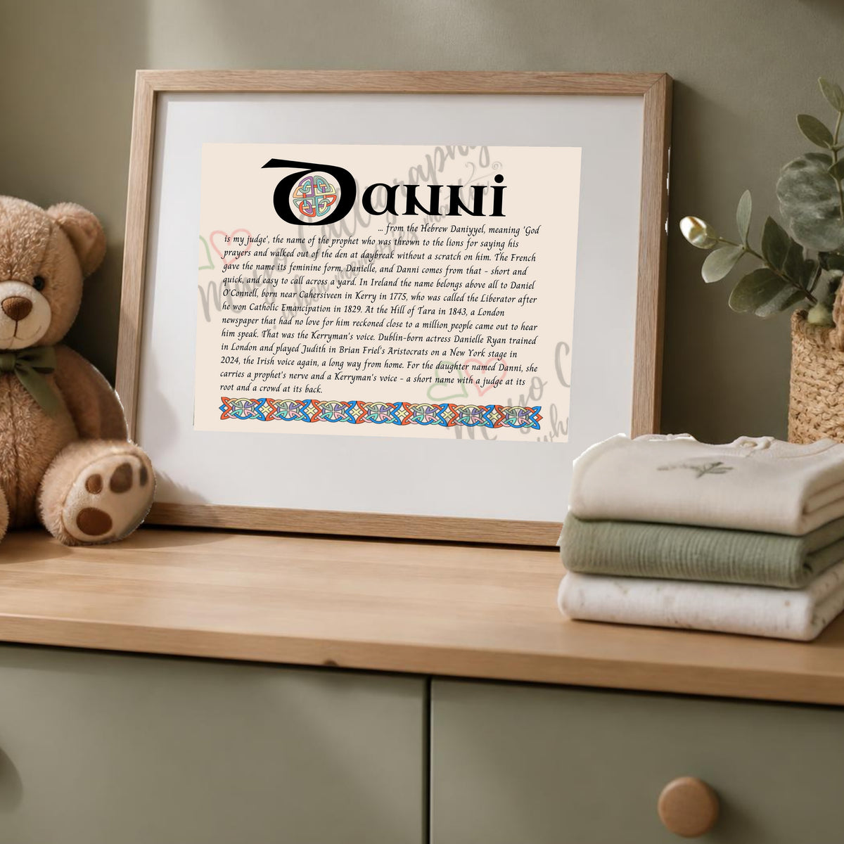Danni Celtic name print in a wooden frame on a dresser with a teddy bear
