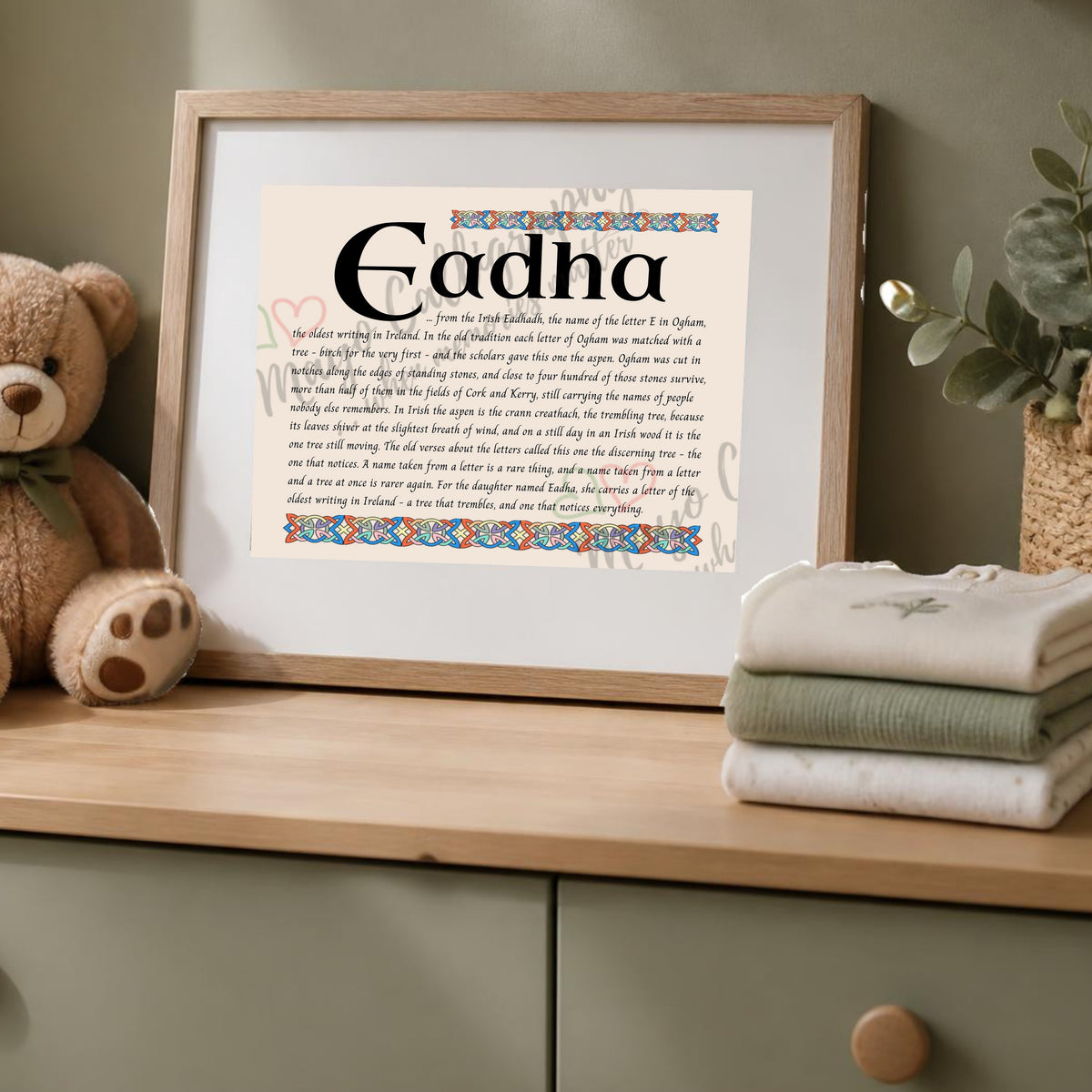 Eadha Celtic name print in a wooden frame on a dresser with a teddy bear