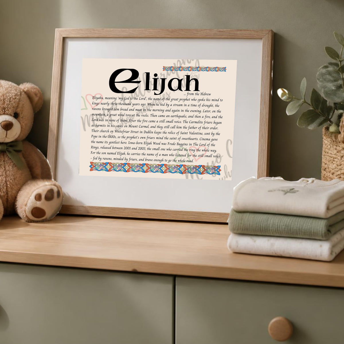 Elijah Celtic name print in a wooden frame on a dresser with a teddy bear