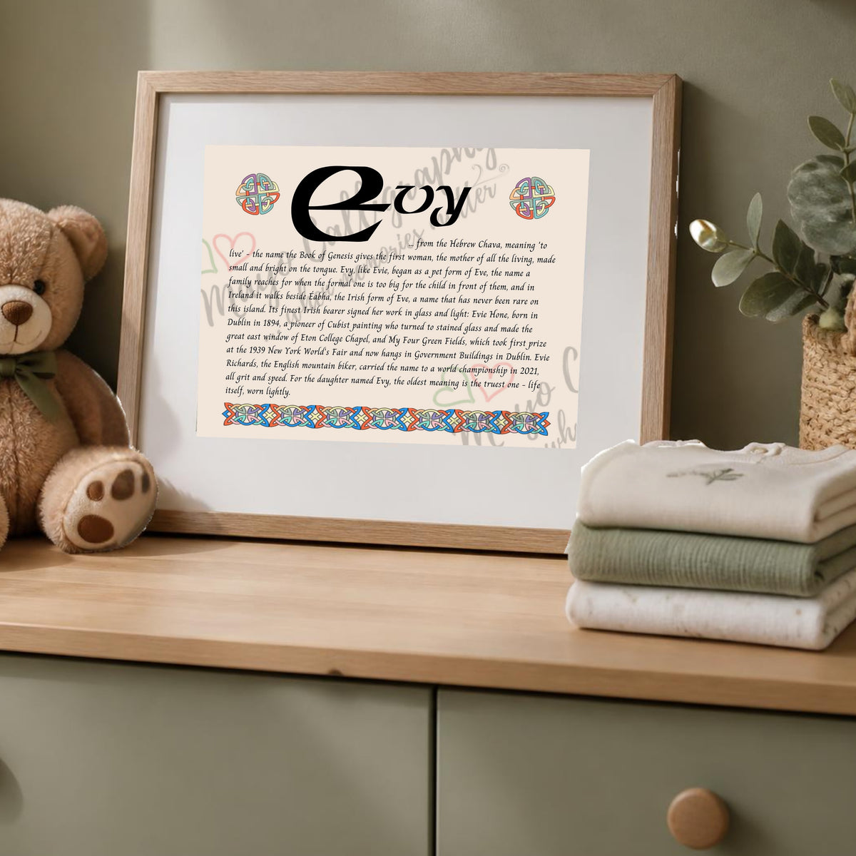 Evy Celtic name print in a wooden frame on a dresser with a teddy bear