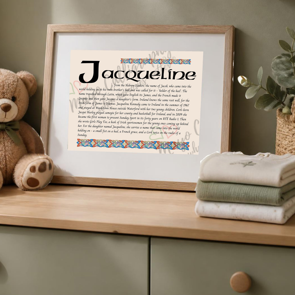 Jacqueline Celtic name print in a wooden frame on a dresser with a teddy bear