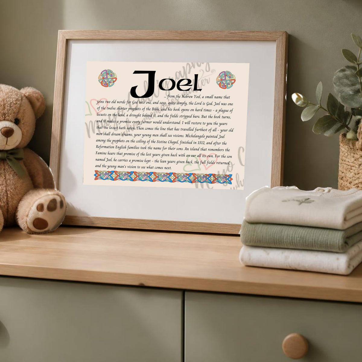 Joel Celtic name print in a wooden frame on a dresser with a teddy bear
