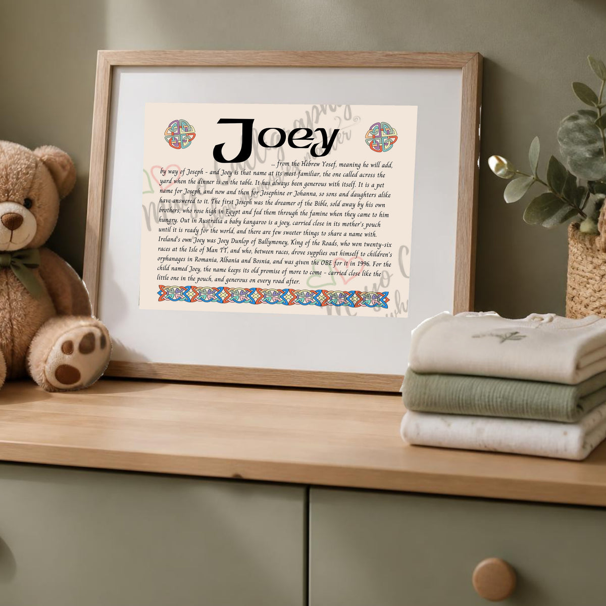 Joey Celtic name print in a wooden frame on a dresser with a teddy bear