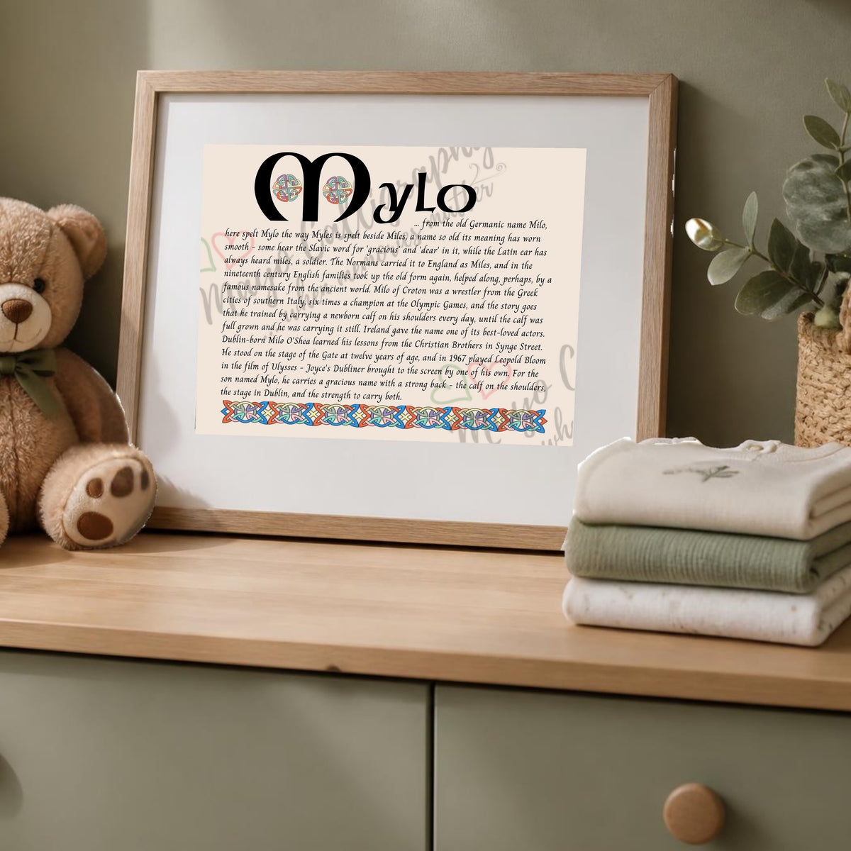 Mylo Celtic name print in a wooden frame on a dresser with a teddy bear